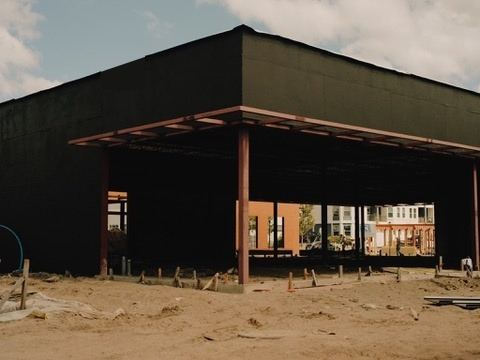 Completed air and water barrier on a large open-air commercial structure