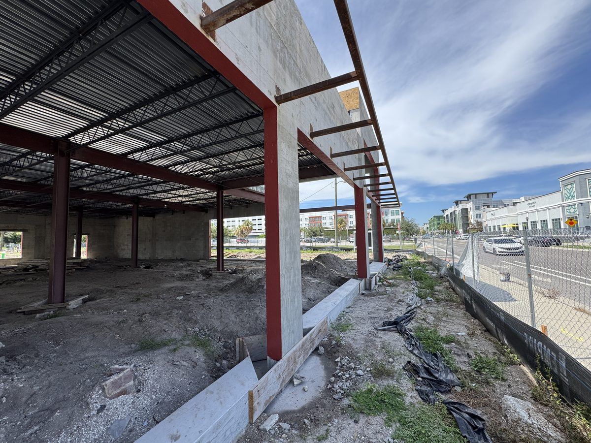 Barrier and flashing at steel-framed canopy and CMU wall transitions